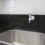 Imagen de Canilla de pared corta con pico Marujá 10 cm blanca